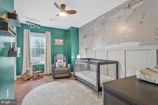 a bedroom with furniture and window