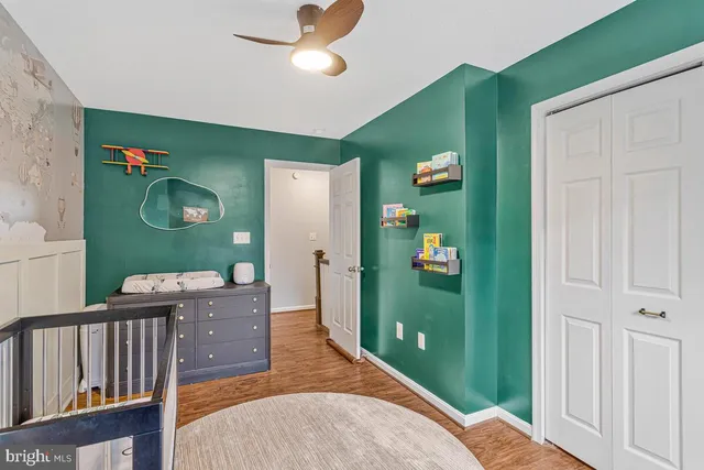 a living room with furniture and a mirror