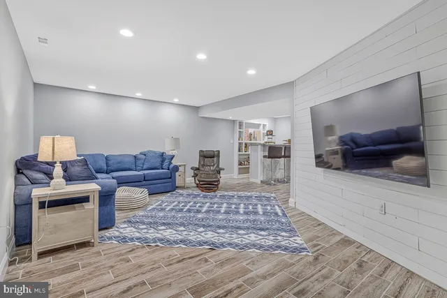 a living room with furniture and a rug