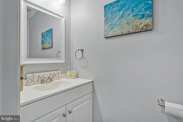 a view of a balcony with wooden floor and outdoor seating