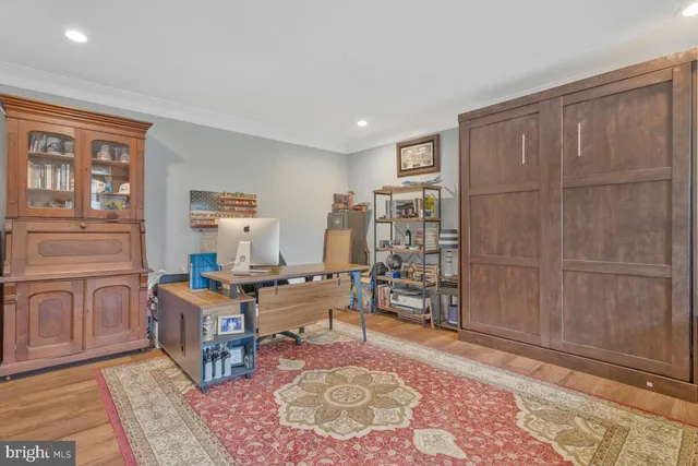 a living room with furniture a rug and a window