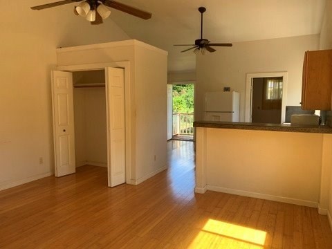 5004 A Awawa Road Eleele, HI 96705 - Photo 12 of 24 a view of a room with wooden floor and a ceiling fan