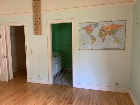 5004 A Awawa Road Eleele, HI 96705 - Photo 17 of 24 a view of a hallway with wooden floor and a cabinet