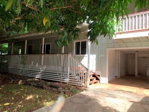 5004 A Awawa Road Eleele, HI 96705 - Photo 22 of 24 a view of a house with a small yard and wooden fence
