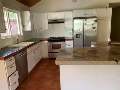5004 A Awawa Road Eleele, HI 96705 - Photo 6 of 24 a kitchen with stainless steel appliances granite countertop a sink stove and refrigerator