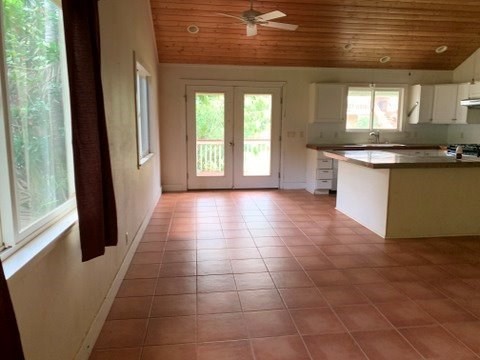 5004 A Awawa Road Eleele, HI 96705 - Photo 7 of 24 a view of a kitchen with an empty space and a window