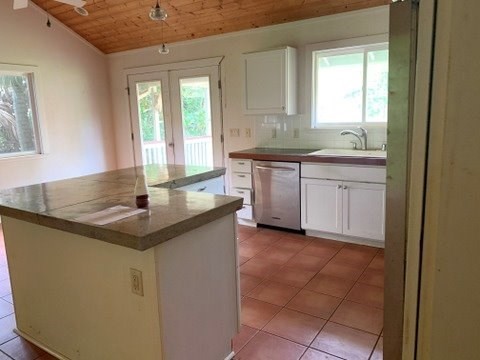5004 A Awawa Road Eleele, HI 96705 - Photo 9 of 24 a kitchen with sink a window and cabinets