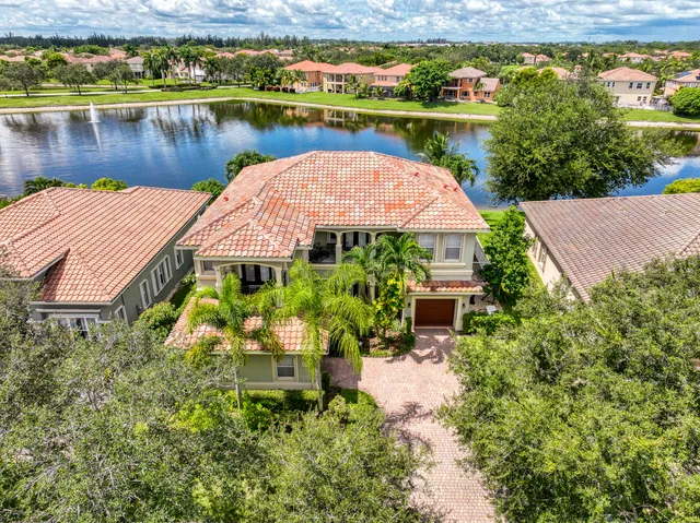 an aerial view of a house with a lake view