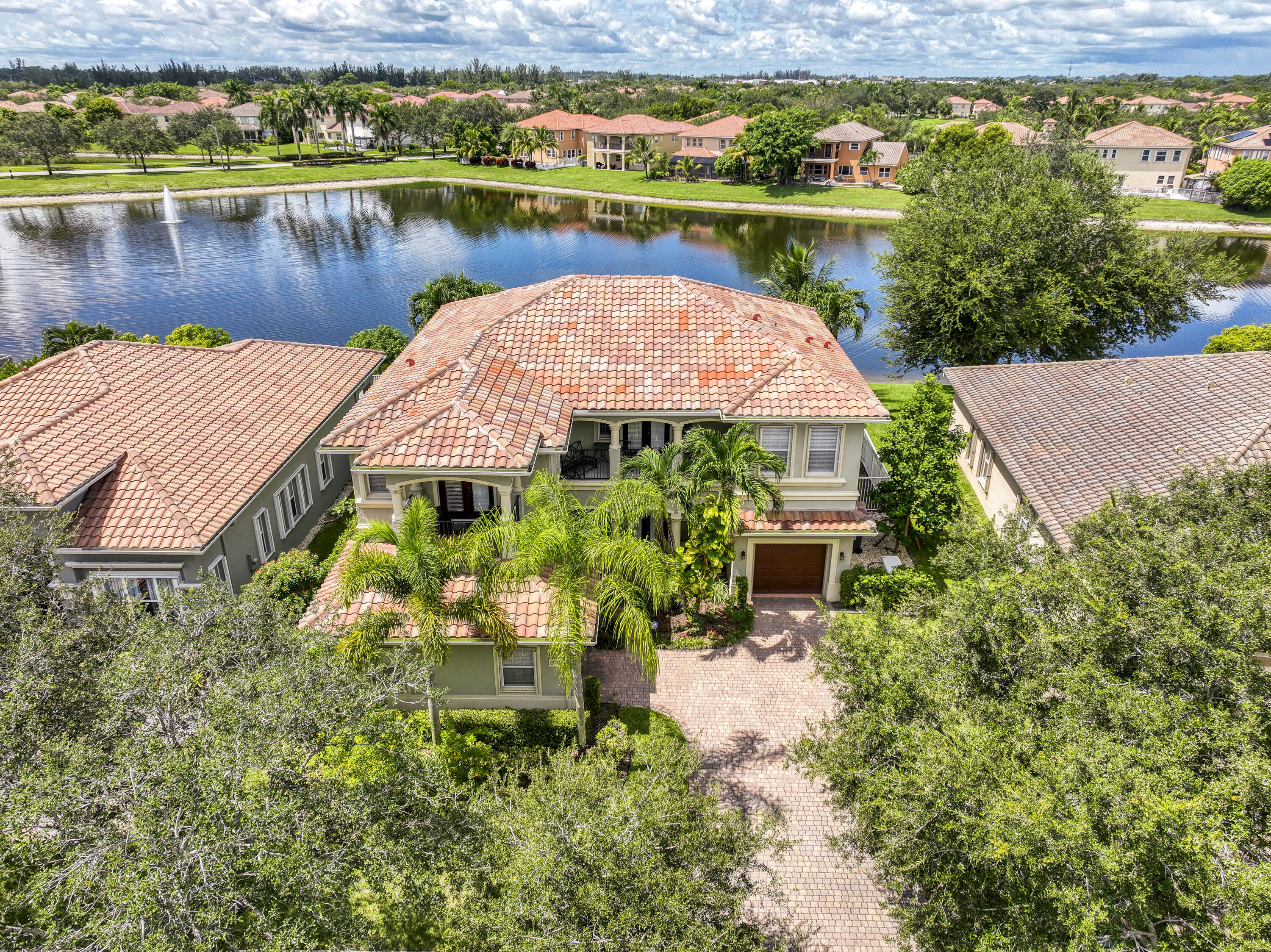 an aerial view of a house with a lake view