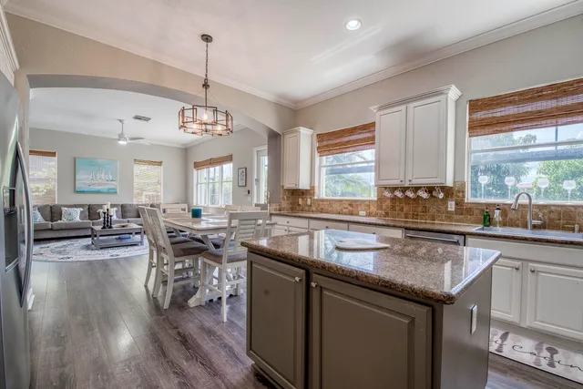 a kitchen with lots of counter top space and dining table