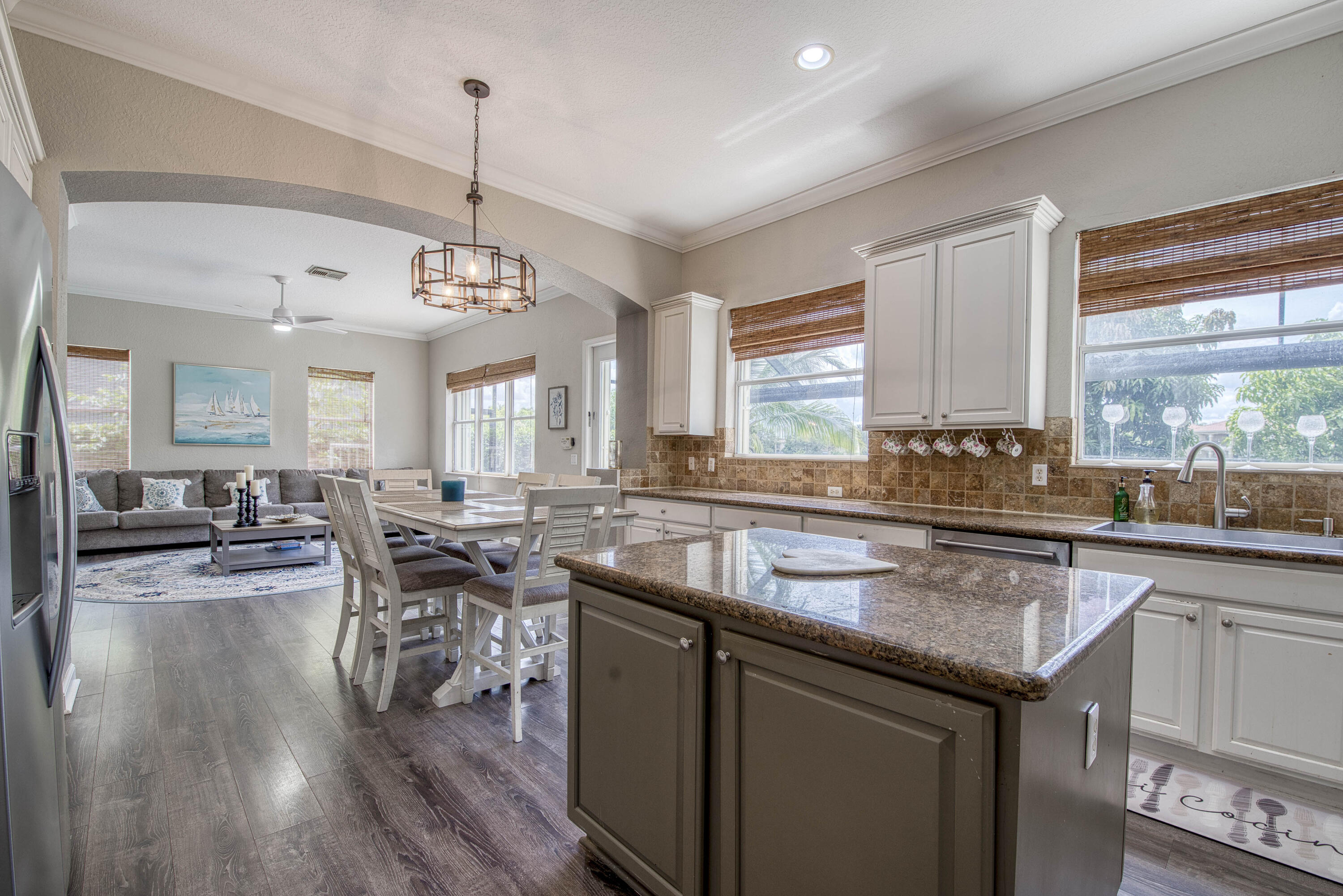 410 Cresta Circle West Palm Beach, FL 33413 - Photo 16 of 46 a kitchen with lots of counter top space and dining table