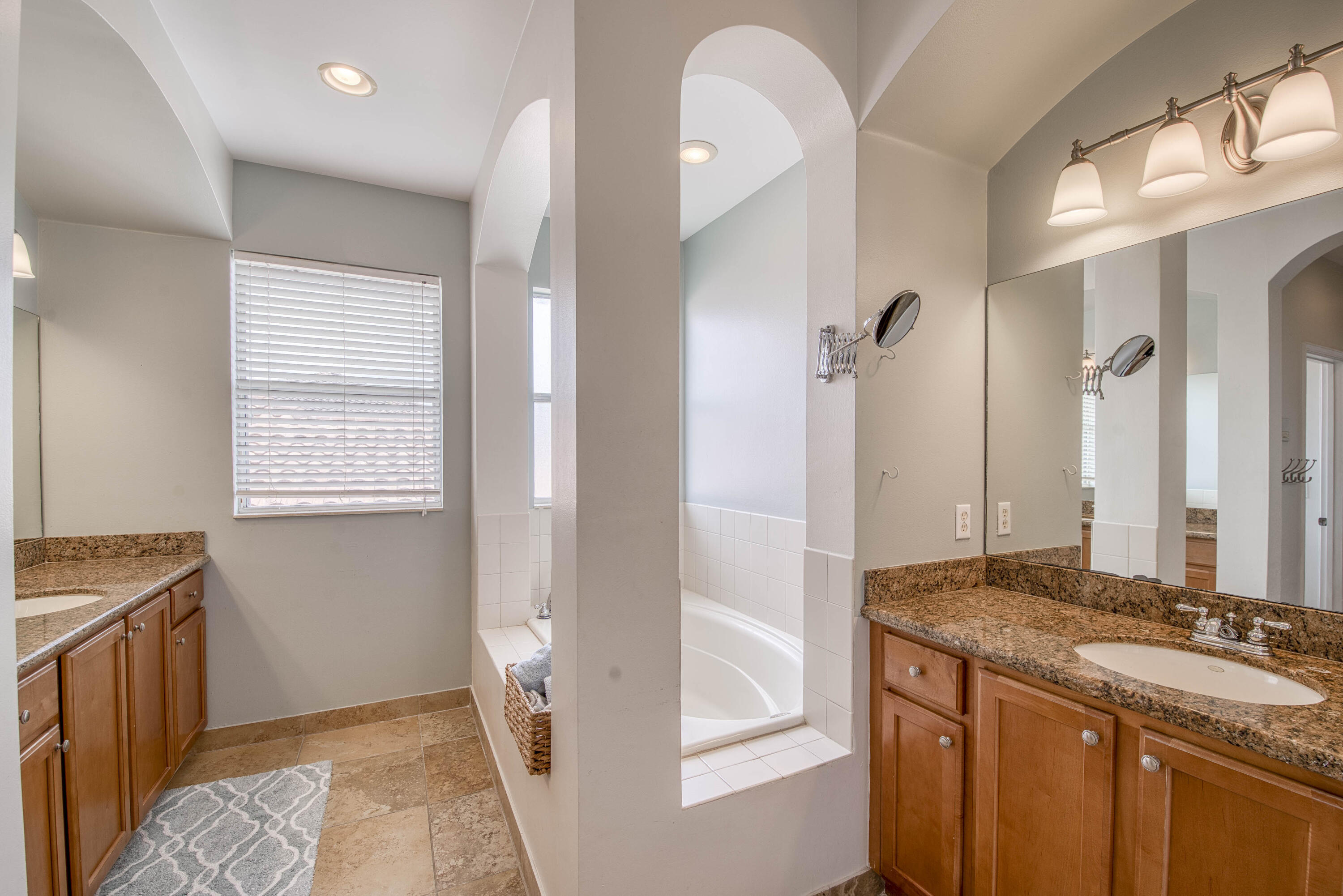 410 Cresta Circle West Palm Beach, FL 33413 - Photo 25 of 46 a bathroom with a granite countertop sink and a mirror