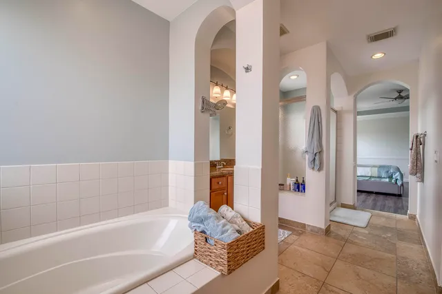 a bathroom with a bathtub and shower