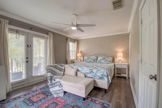 a bedroom with a bed couch and a window