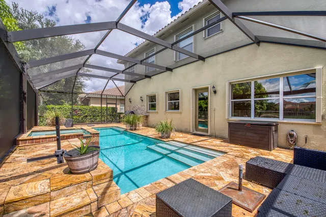 a view of a backyard with table and chairs