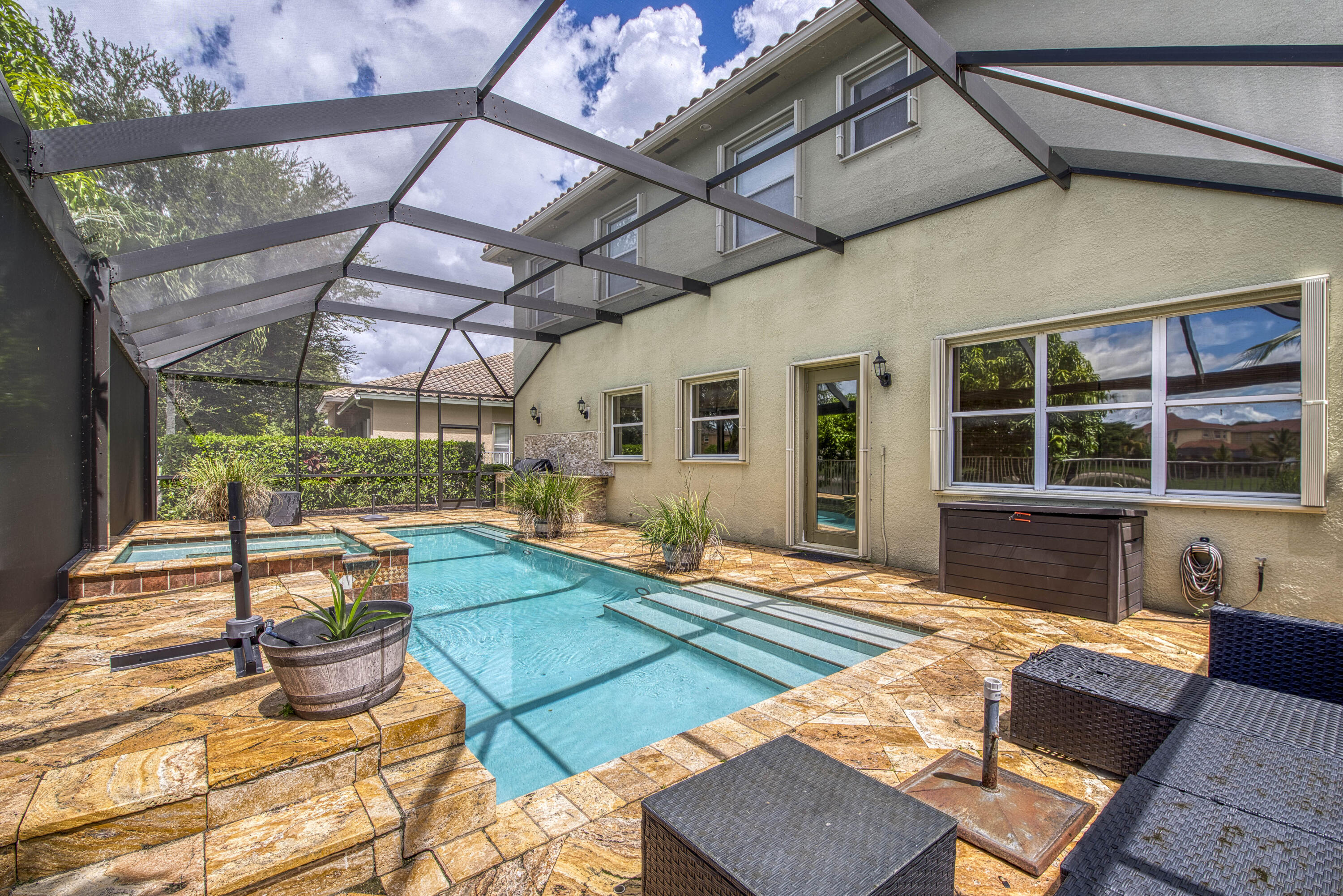 410 Cresta Circle West Palm Beach, FL 33413 - Photo 34 of 46 a view of a backyard with table and chairs