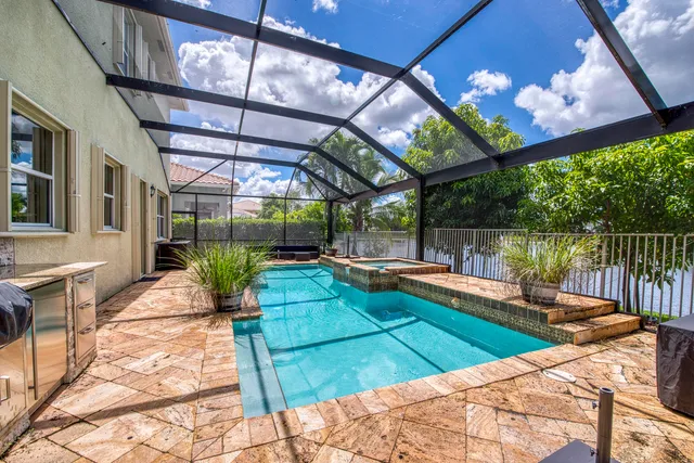 a view of a swimming pool with a patio