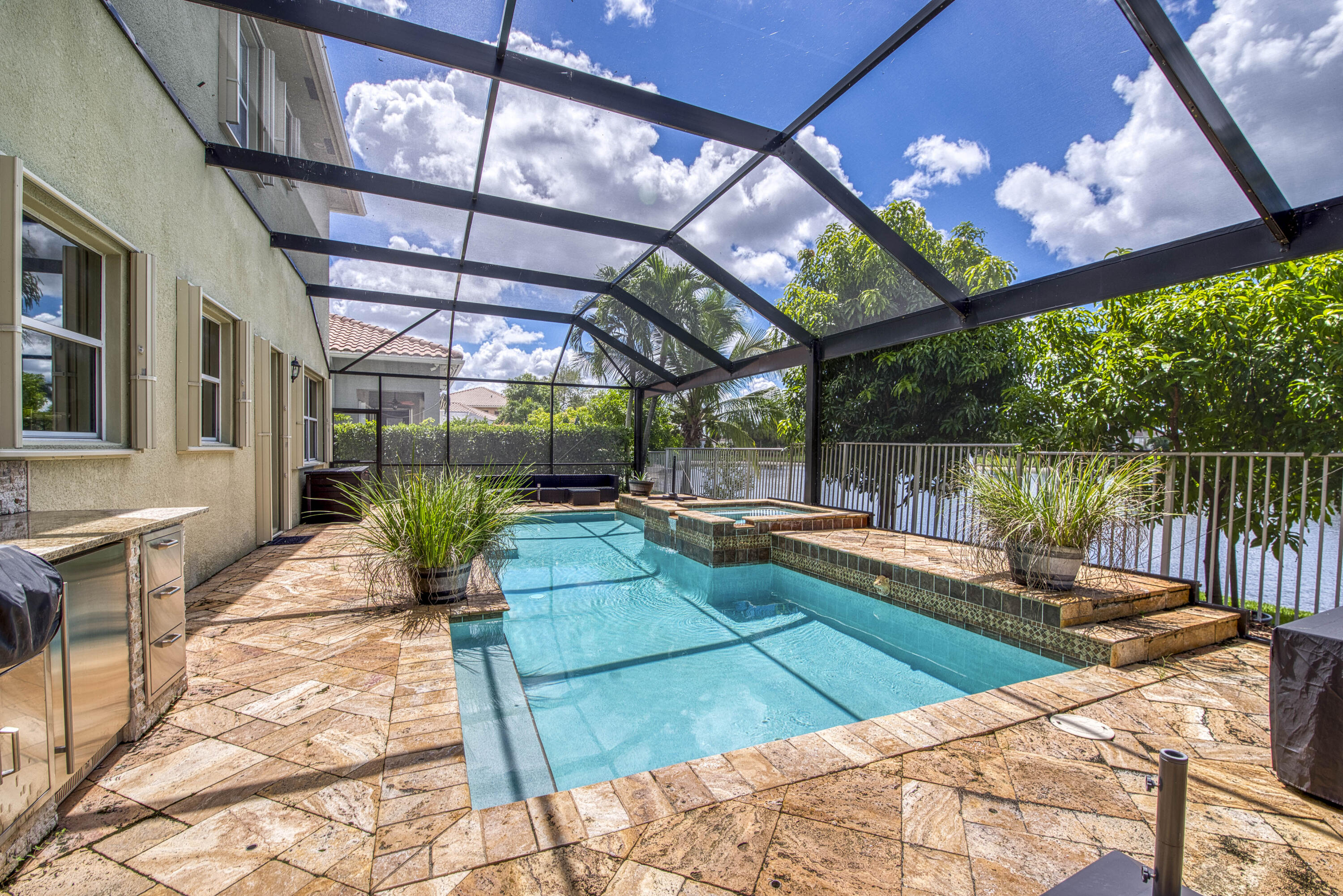 410 Cresta Circle West Palm Beach, FL 33413 - Photo 36 of 46 a view of a swimming pool with a patio