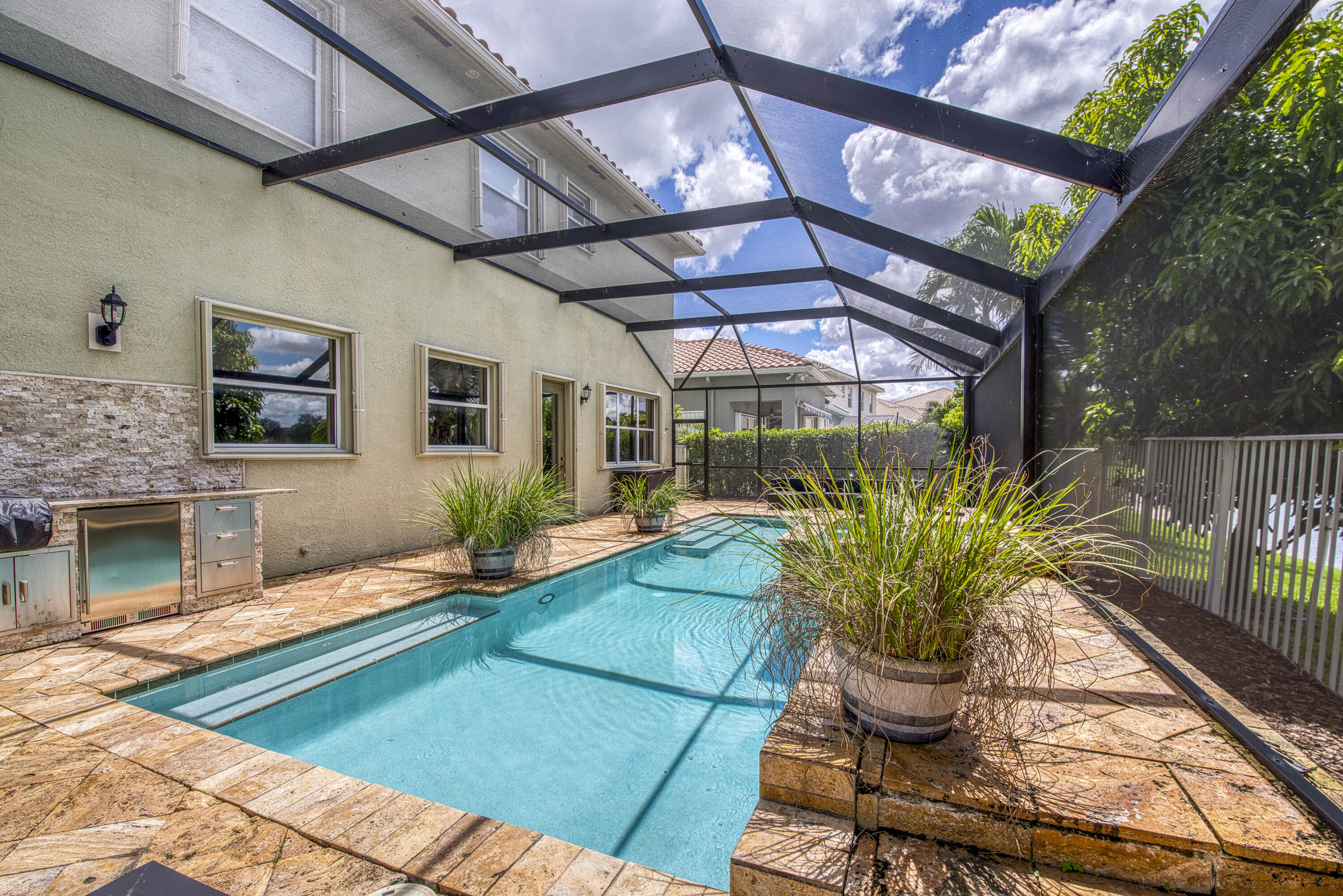 410 Cresta Circle West Palm Beach, FL 33413 - Photo 37 of 46 a view of a chairs and table in the patio