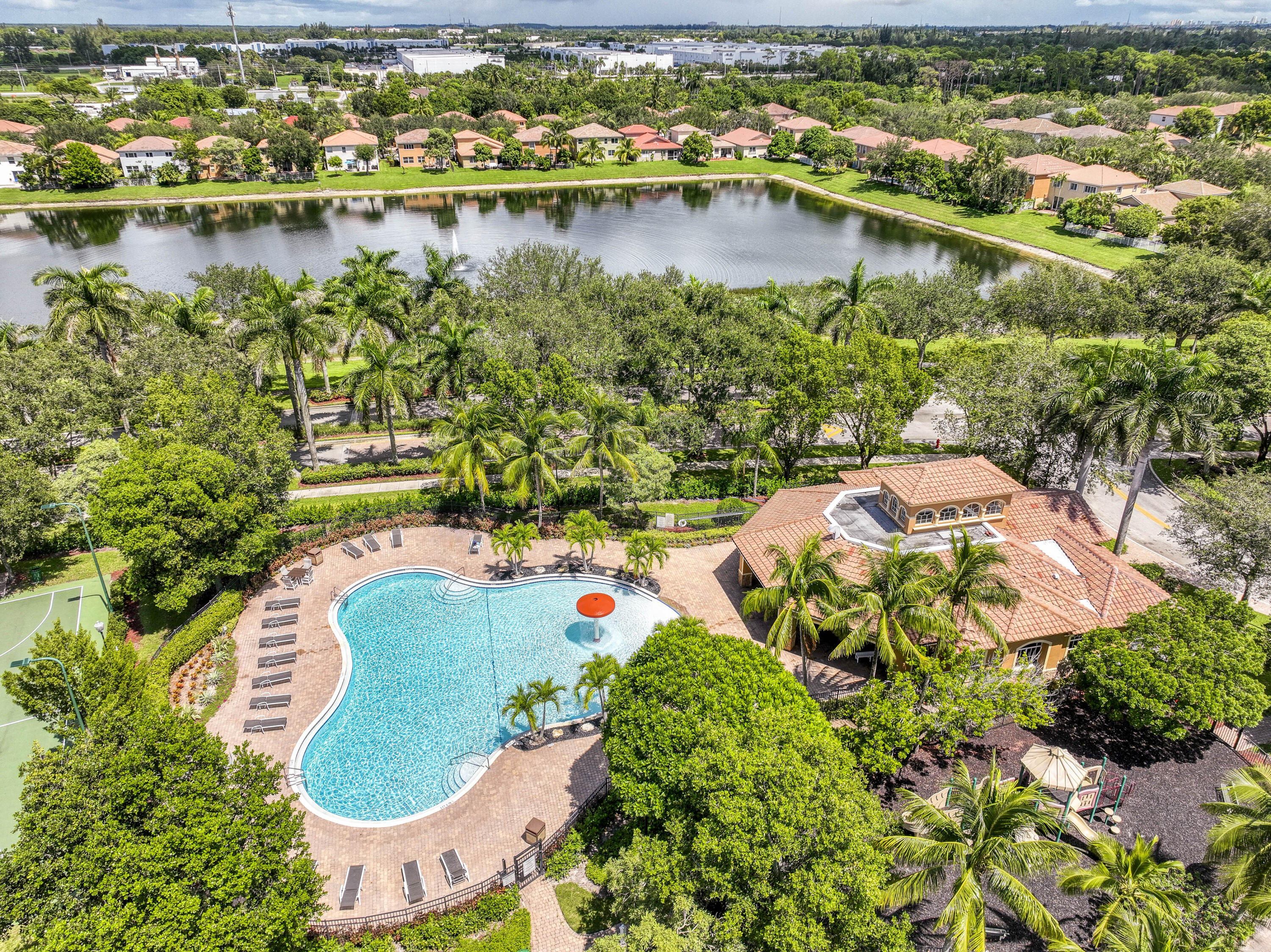 410 Cresta Circle West Palm Beach, FL 33413 - Photo 40 of 46 an aerial view of lake residential house with outdoor space and trees all around