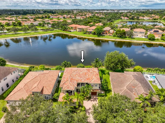 an aerial view of house with a lake view