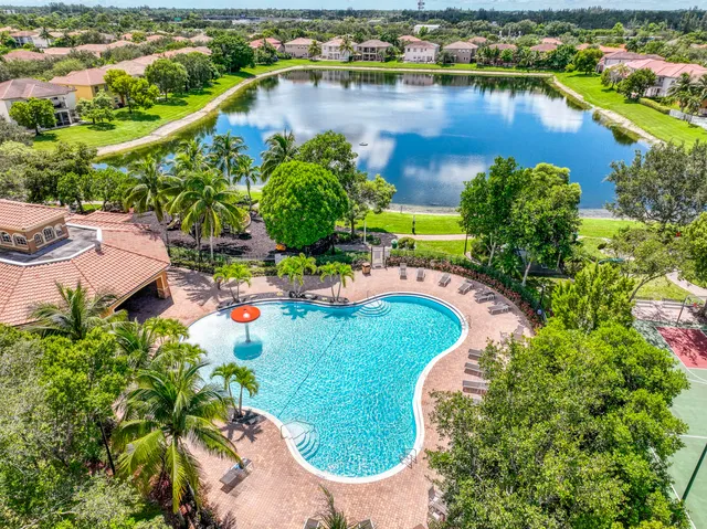 an aerial view of a house with a lake view