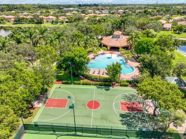 an outdoor space with swimming pool and outdoor seating