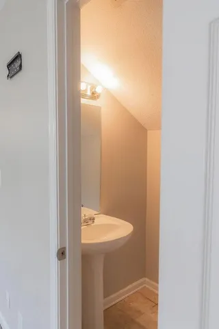 a bathroom with a sink and mirror