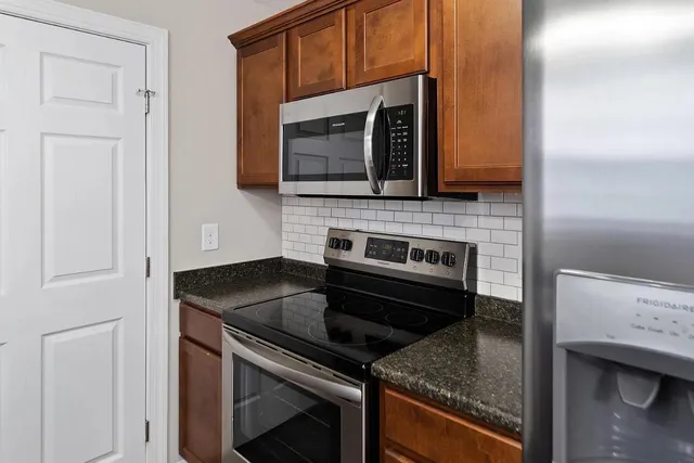 a kitchen with a stove and a microwave