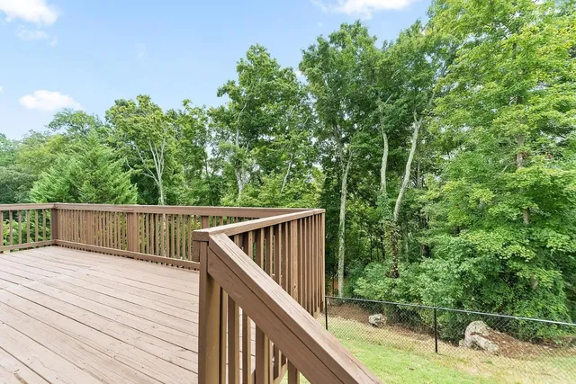 a view of balcony and yard
