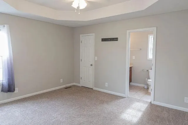 an empty room with a bathroom