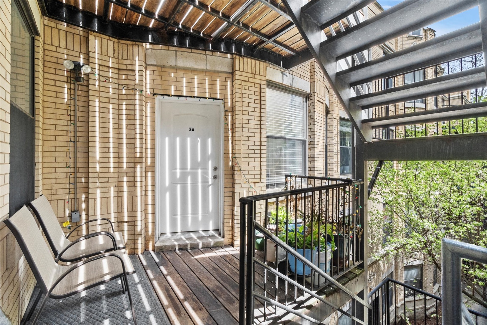 6414 North Hoyne Avenue, Unit 3W Chicago, IL 60645 - Photo 15 of 16 a view of a balcony with furniture