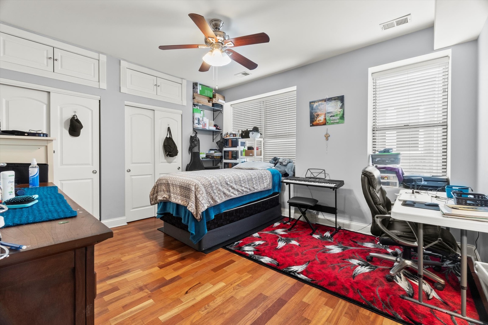 6414 North Hoyne Avenue, Unit 3W Chicago, IL 60645 - Photo 10 of 16 a bedroom with bed and a window