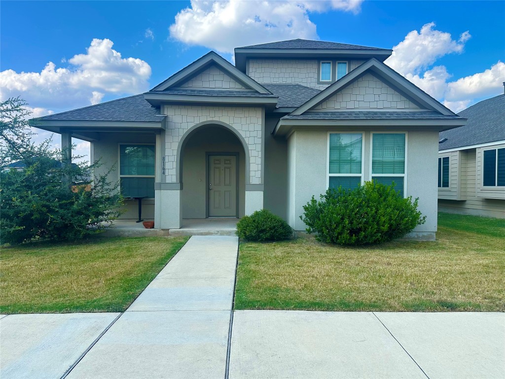 8164 Daisy Cutter Crossing Georgetown, TX 78626 - Photo 1 of 19 a front view of a house with garden