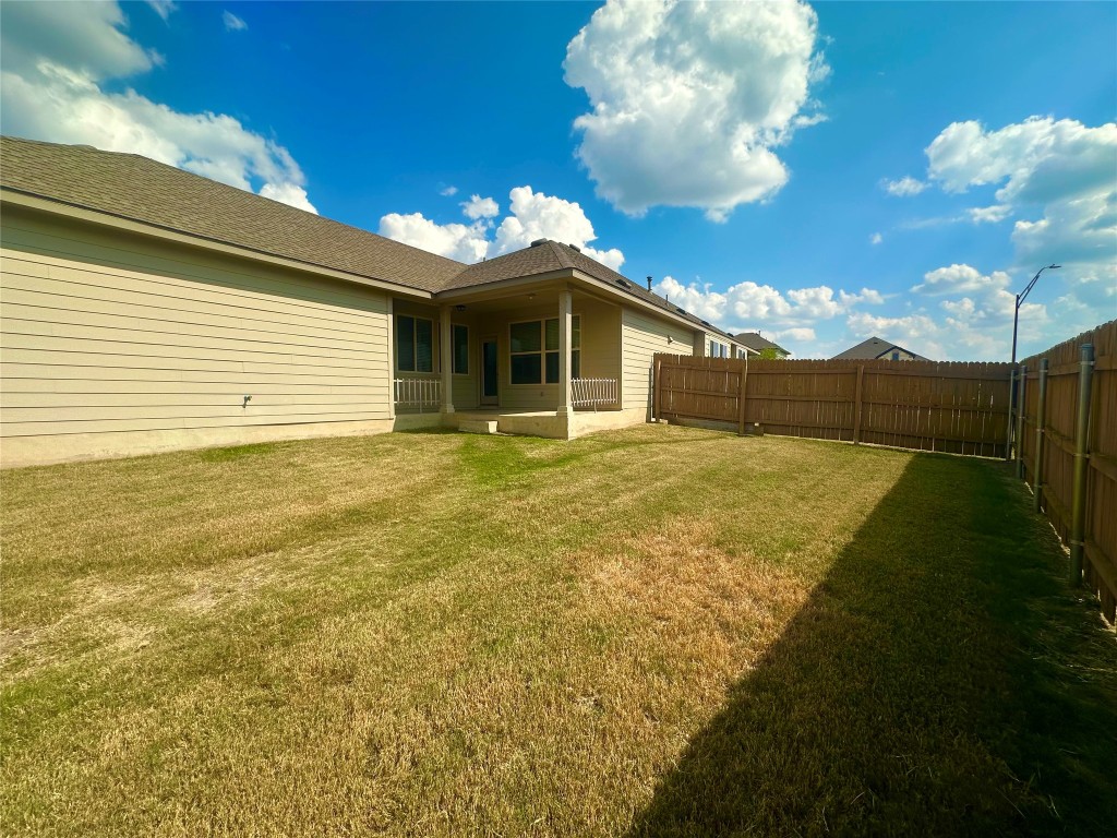 8164 Daisy Cutter Crossing Georgetown, TX 78626 - Photo 19 of 19 a view of a house with a yard