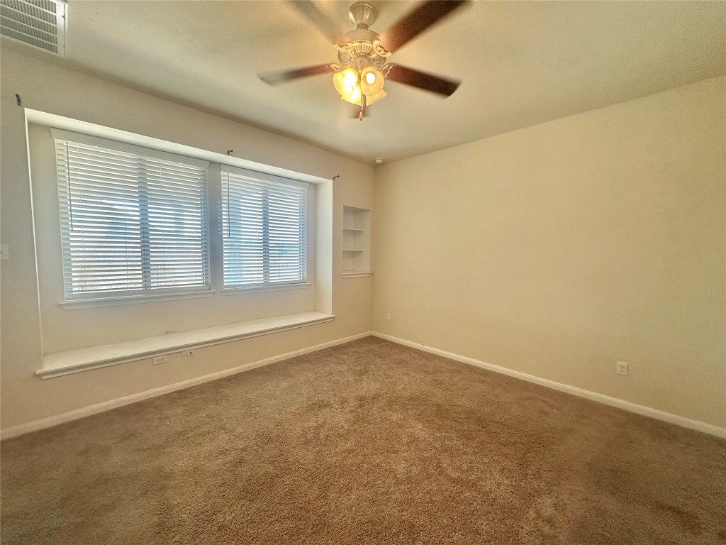8164 Daisy Cutter Crossing Georgetown, TX 78626 - Photo 8 of 19 a view of an empty room with a window