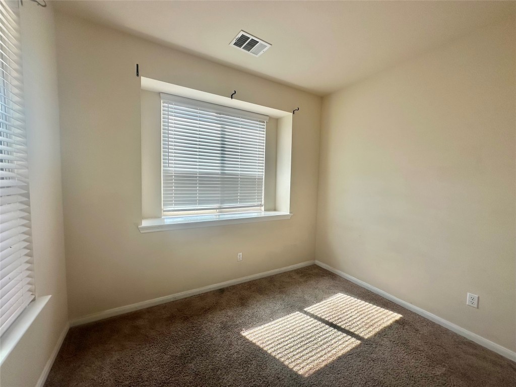 8164 Daisy Cutter Crossing Georgetown, TX 78626 - Photo 10 of 19 a view of an empty room with a window