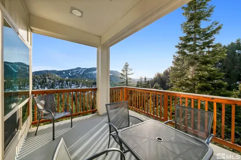a view of a balcony with furniture