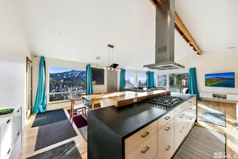 a kitchen with stainless steel appliances granite countertop a stove and a refrigerator