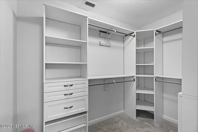 a view of an empty walk in closet