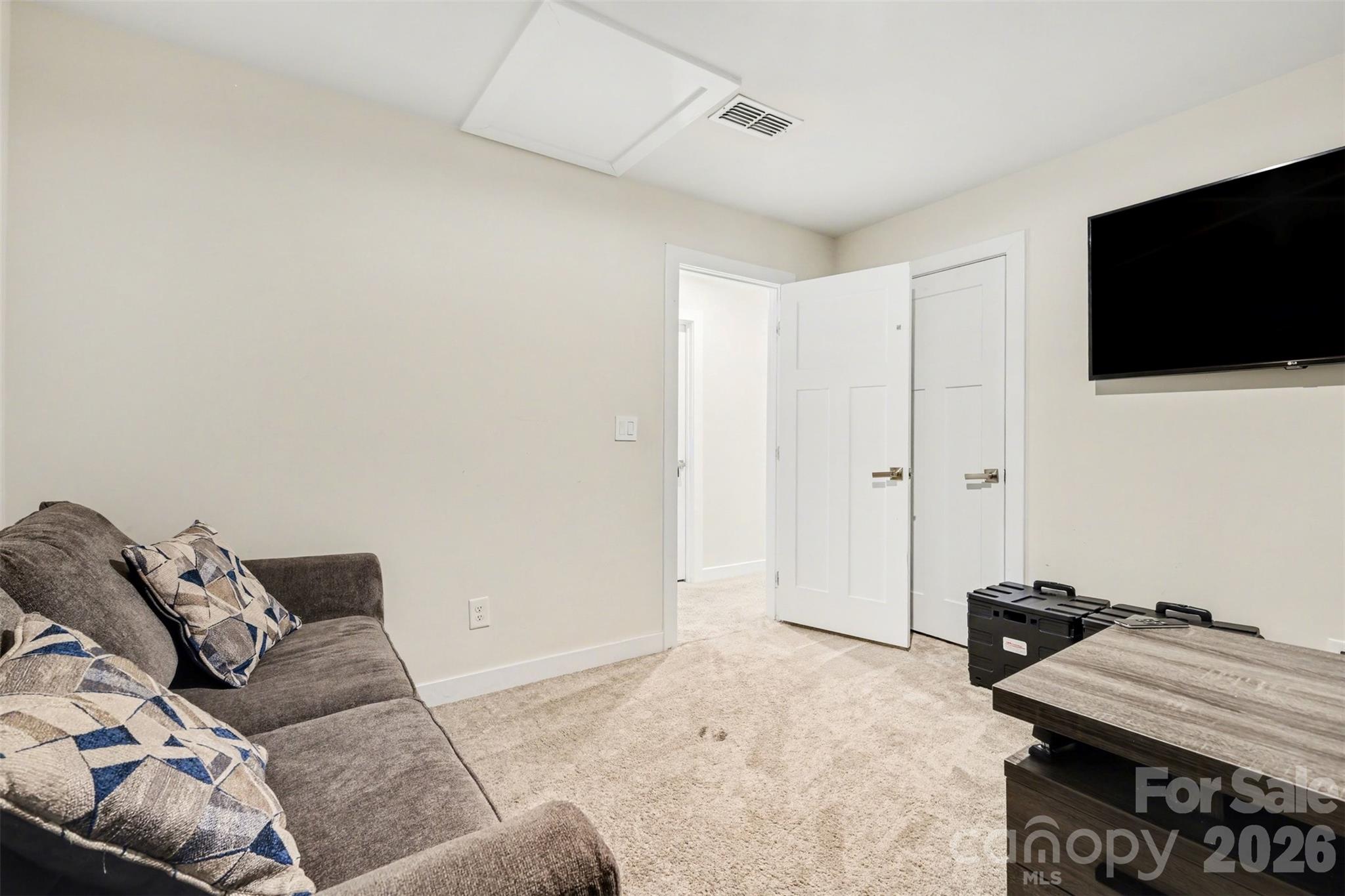 1840 Scarbrough Circle Southwest Concord, NC 28025 - Photo 13 of 29 a living room with furniture and a flat screen tv