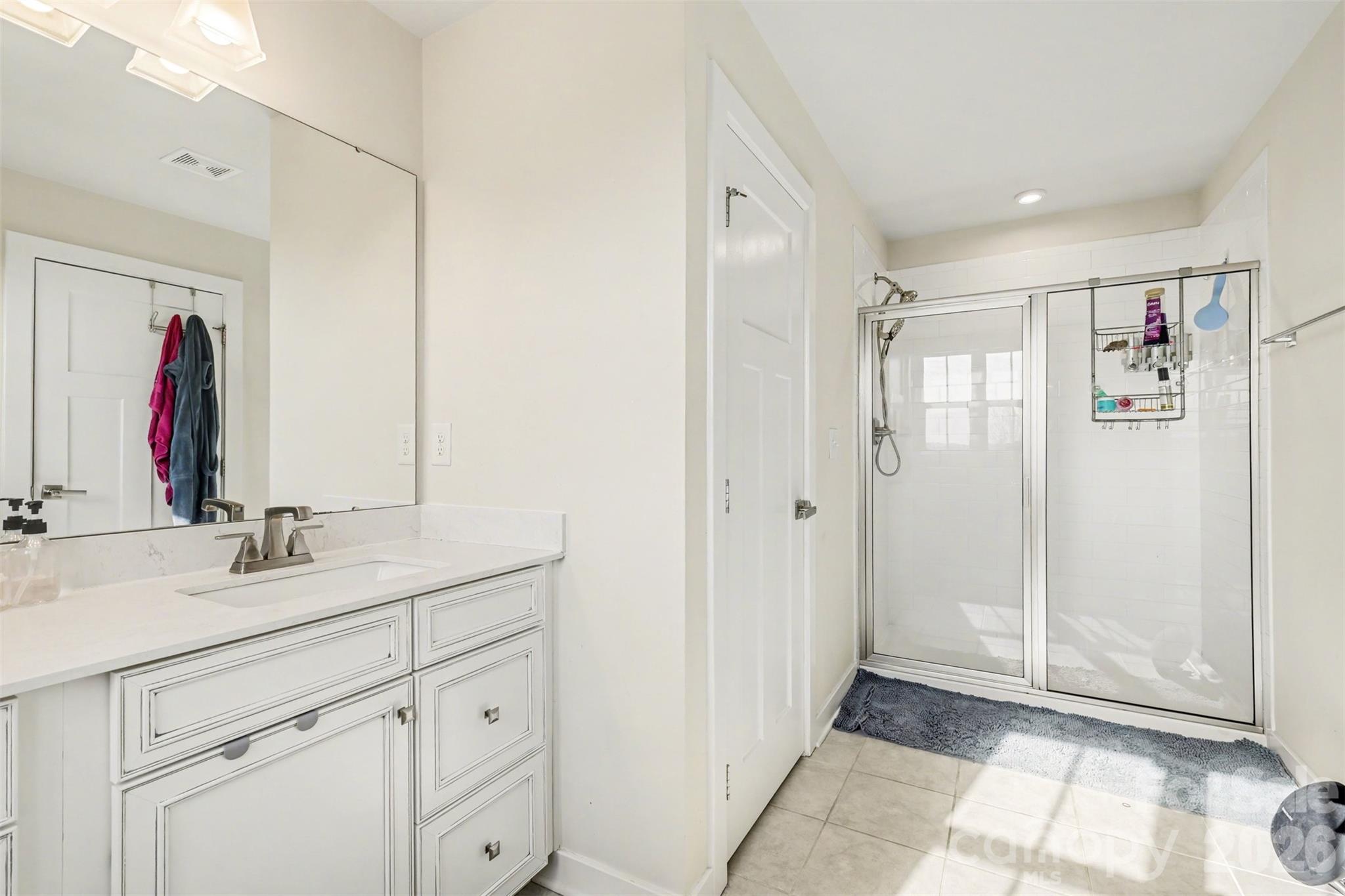 1840 Scarbrough Circle Southwest Concord, NC 28025 - Photo 18 of 29 a bathroom with a double vanity sink mirror and double