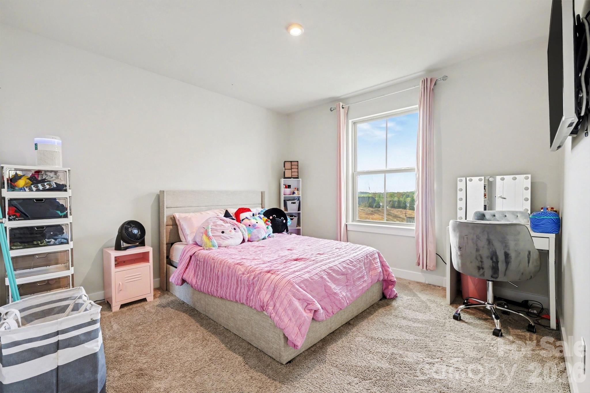 1840 Scarbrough Circle Southwest Concord, NC 28025 - Photo 19 of 29 a bedroom with a bed and a window