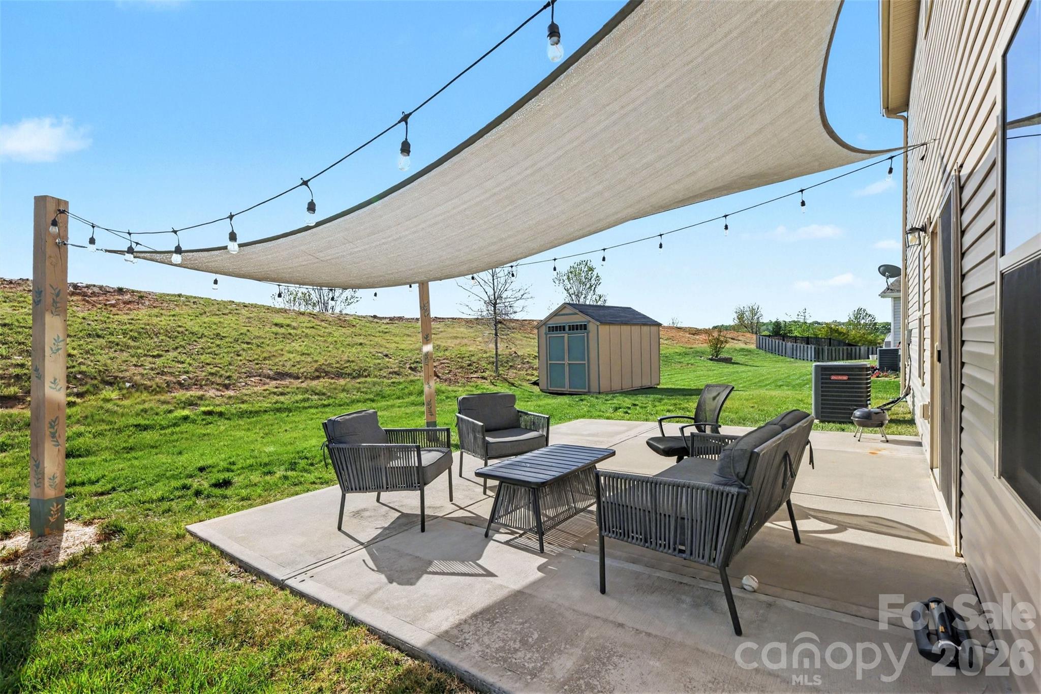 1840 Scarbrough Circle Southwest Concord, NC 28025 - Photo 24 of 29 a patio with yard table and chairs