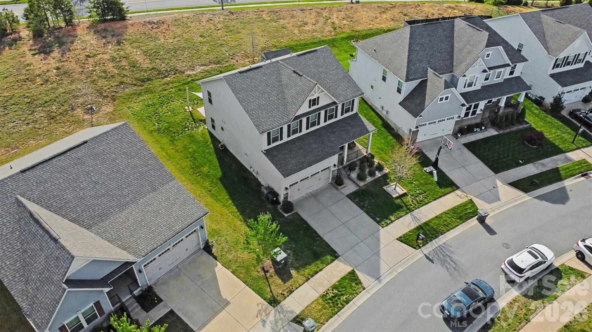 1840 Scarbrough Circle Southwest Concord, NC 28025 - Photo 26 of 29 an aerial view of houses with backyard