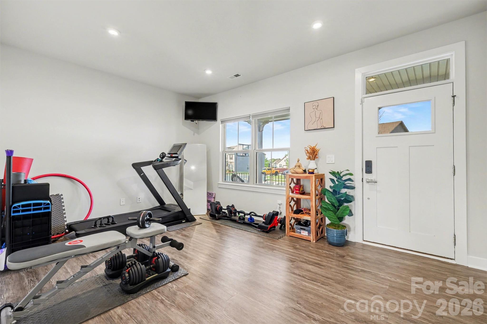 1840 Scarbrough Circle Southwest Concord, NC 28025 - Photo 4 of 29 a view of a room with gym equipment