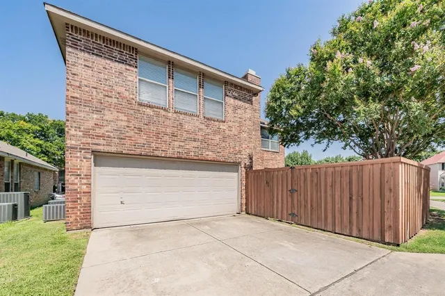 a front view of a house with a garage