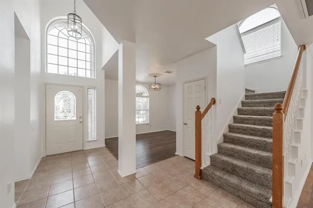a view of an entryway with wooden floor