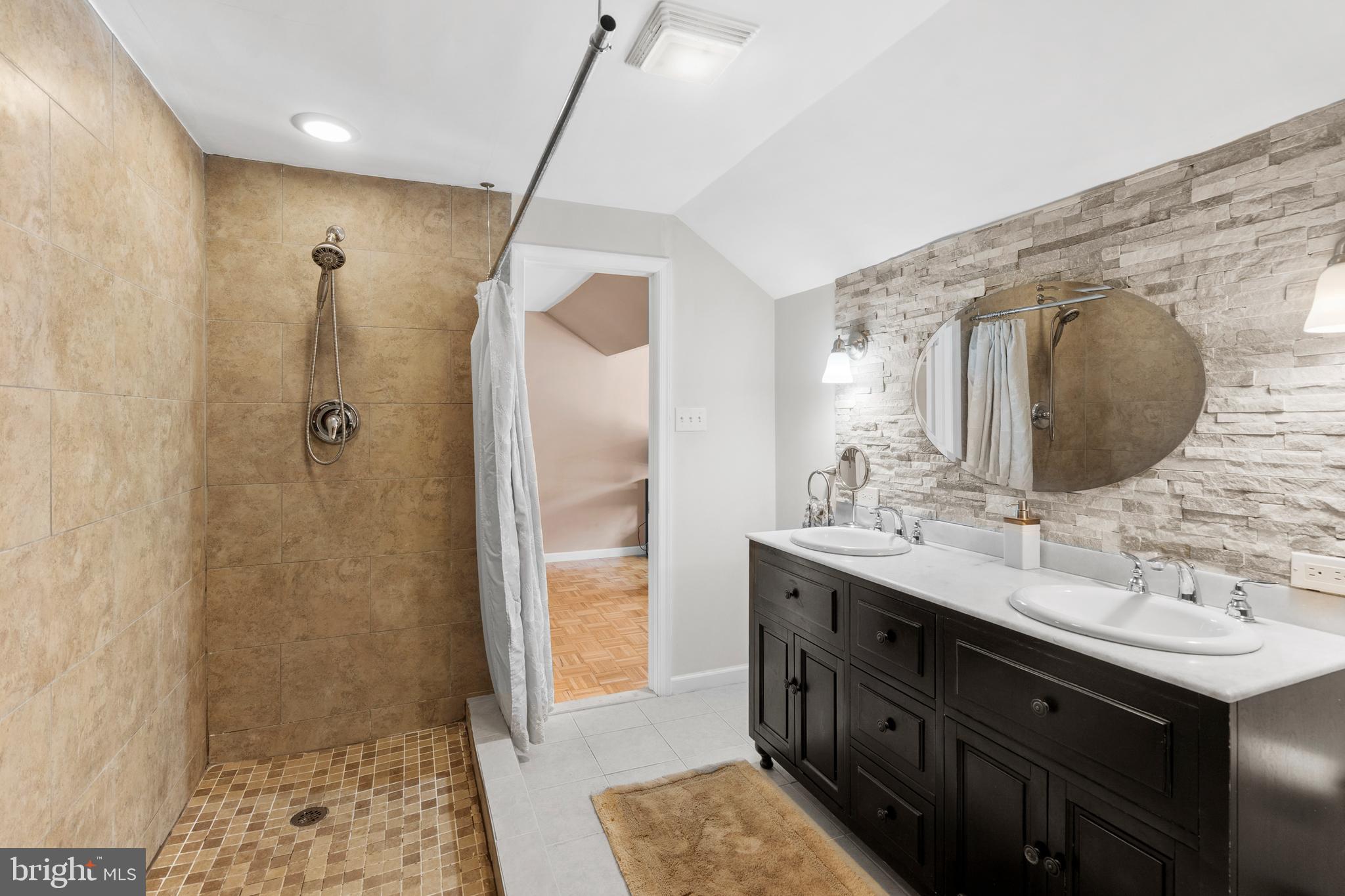 1118 Allston Road Havertown, PA 19083 - Photo 39 of 58 a bathroom with a double vanity sink a mirror and a shower