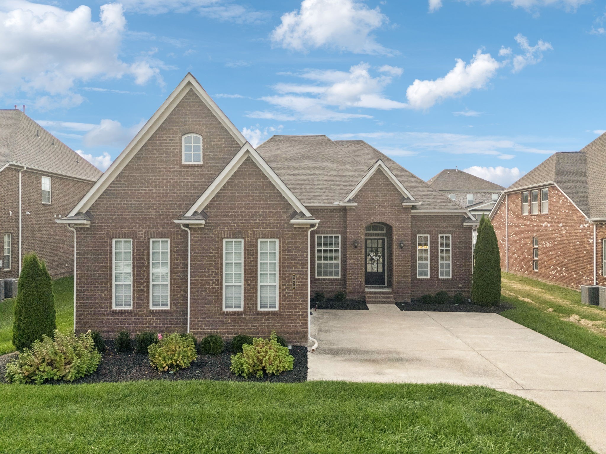 3639 Martins Mill Road Thompson's Station, TN 37179 - Photo 1 of 35 a front view of a house with a garden